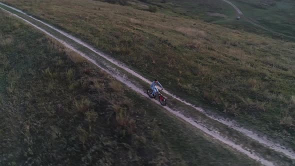 Aerial View of the Guy Is Cycling Out of Town