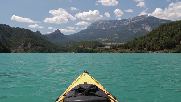 First Person View Looking From Yellow Kayak Swaying on Waves of Emerald Lake