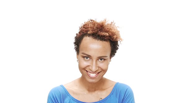 Shy Young Beautiful African Girl Smiling Over White Background