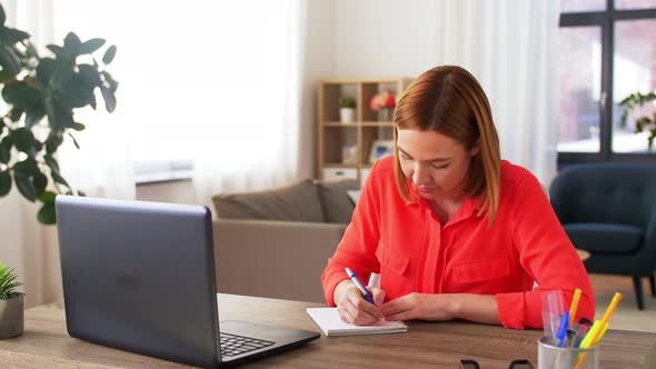 Woman with Laptop Having Video Call at Home Office