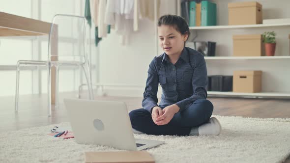 Happy Teenage Girl Smiling Waving Hand Making a Video Call With Teacher Mentor