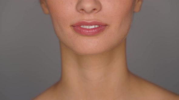 Beautiful Smiling Young Woman with Bare Shoulder