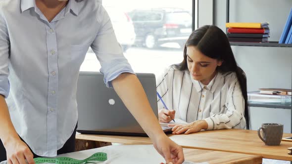 Team of Fashion Designers Working Together at the Office 1080p