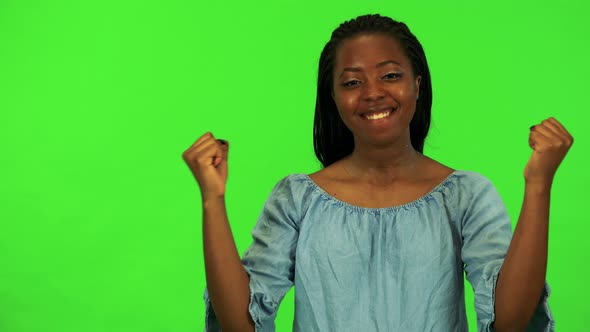 A Young Black Woman Celebrates - Green Screen Studio