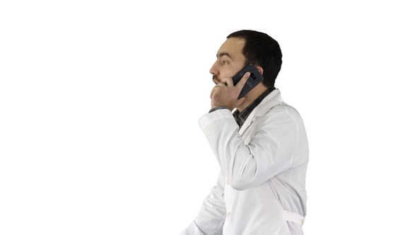 Doctor talking on mobile phone on white background.