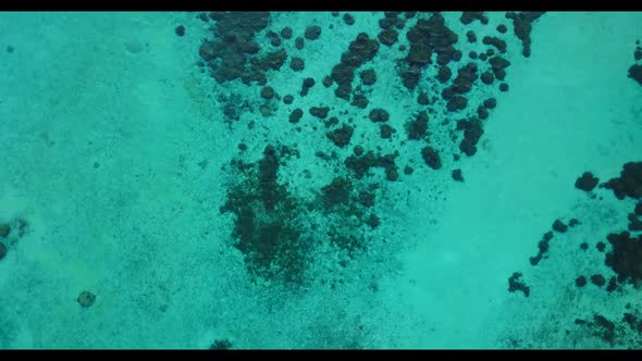 Aerial view tourism of perfect seashore beach journey by blue ocean and white sandy background of a 