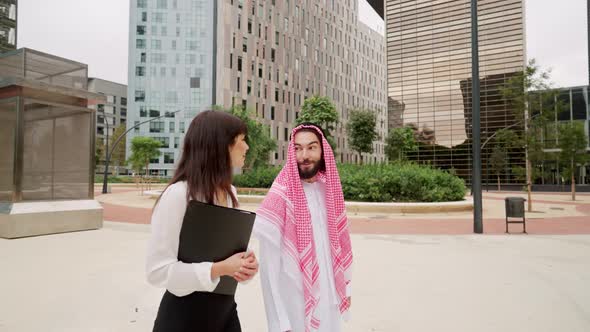 Arab Man Discussing Business with Colleague