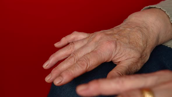 Elderly Woman's Hands on Knees