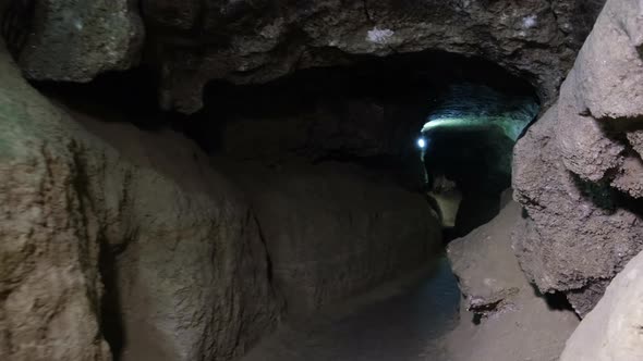 Speleology, cave, dungeon, dark tunnel, underground excavations. The old cave is formed by water