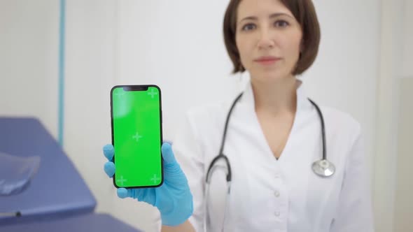 Gynecologist Shows an Smartphone with a Chromakey