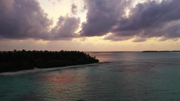 Aerial top view nature of idyllic tourist beach voyage by blue lagoon with white sandy background of