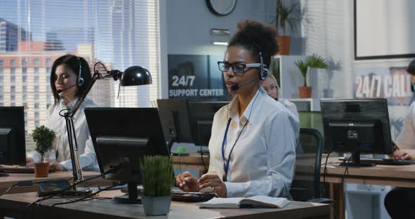 Young Woman Working at Her Desk