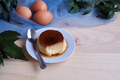 Homemade egg custard on wooden table - PhotoDune Item for Sale