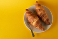Croissants with yellow background - PhotoDune Item for Sale