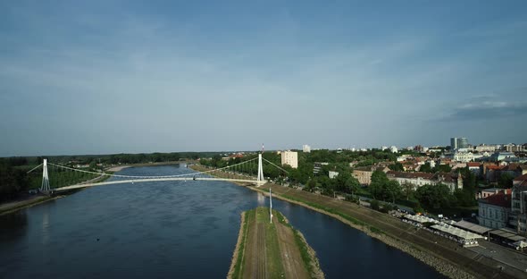 Aerial view of Osijek harbour along Drava river with Pjesacki bridge, Croatia.