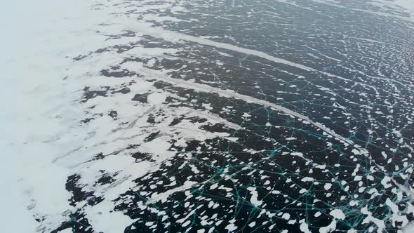 Aerial View of the Winter Frozen Lake Captured with a Drone in Finland