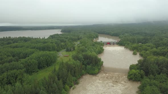 Aerial View of the Dam During Floods. Extremely High Water Level in the River.