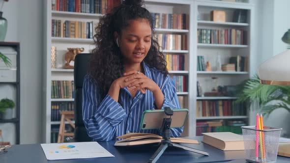 Young Indian Woman Receives Distance Education Talking on Video Call on Phone