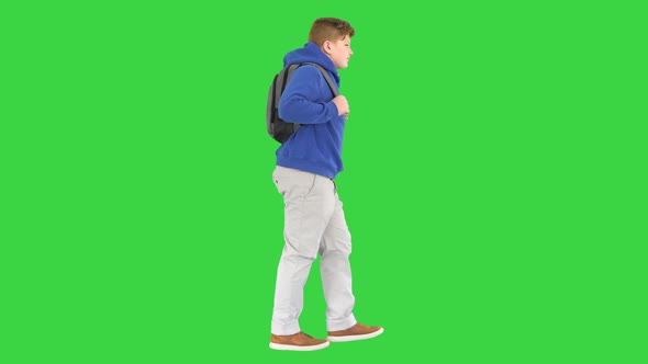 Male Student with a Backpack Walking on a Green Screen Chroma Key