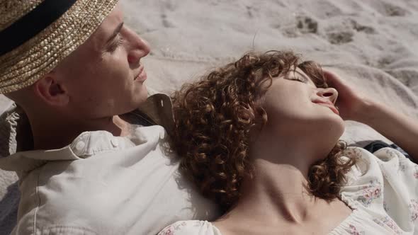 Relaxed Girl Lying Boyfriend Chest Relaxing on Beach Close Up