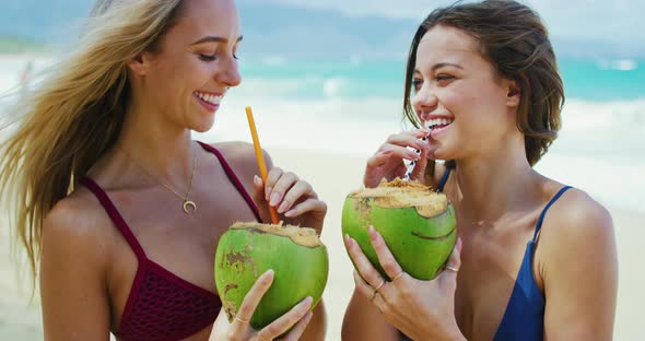 Beautiful Girls Drinking Coconuts