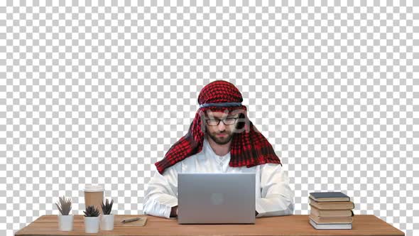 Arabian businessman using laptop at the table, Alpha Channel