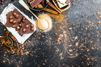 Chocolat and spices on black table