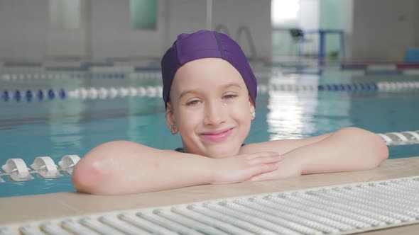 Girl Child in Swimming Pool. Smiling Child Leads a Healthy Lifestyle and Keen on Sports.