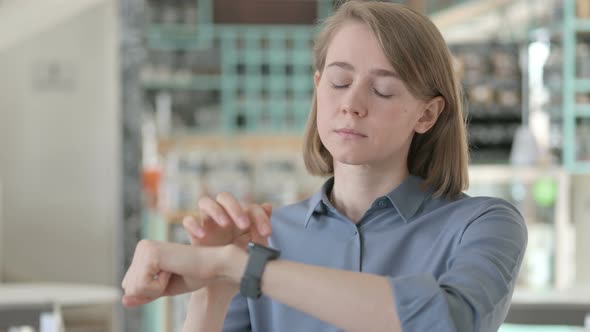 Portrait of Young Woman Using Smartwatch