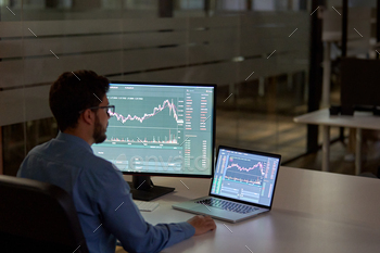 Busy business man broker analyst investor using computer analyzing stock market.