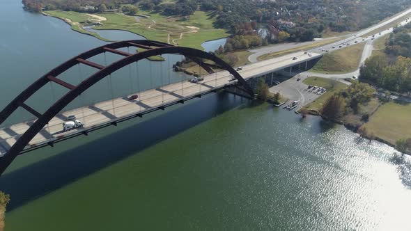 This video is about an aerial of the Pennybacker Bridge in Austin, Texas. The bridge passes over Lak