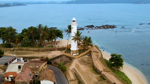 Aerial drone of Galle fort Lighthouse at sunset golden hour. Galle Dutch Fort, Sri lanka