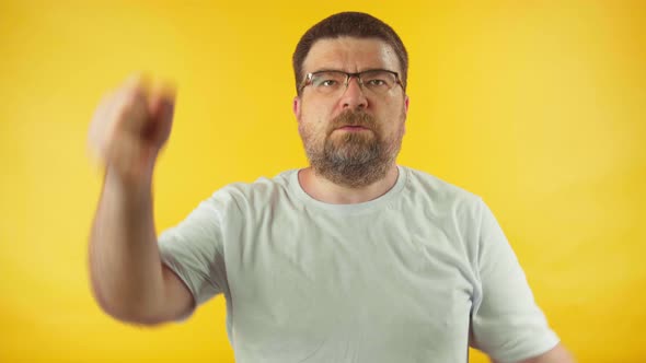 Caucasian middle aged man in white t-shirt doing exercises, doing fitness