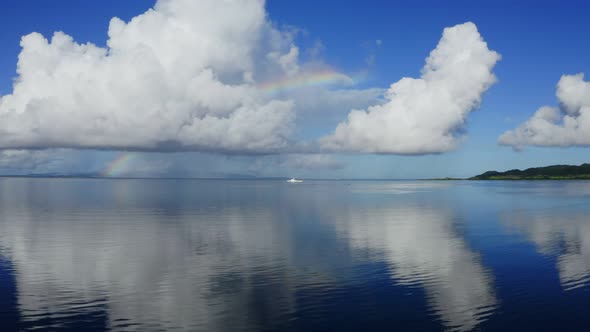 Blue sky and sea with rainbow in ishigaki island