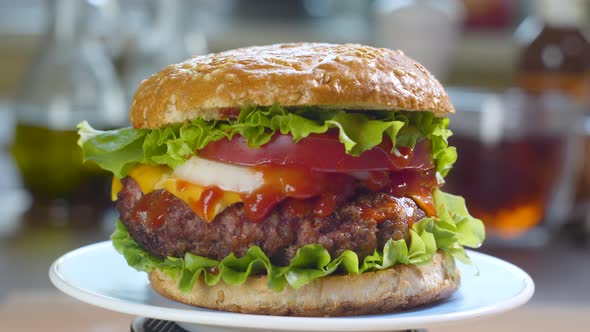 Beef Burger Rotating on the Kitchen Table