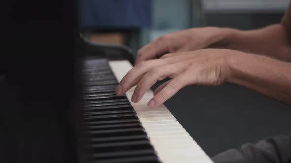 Male Hands Playing Piano