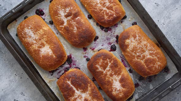 Delicious Hot Homemade Buns Stuffed with Blueberry on a Baking Tray