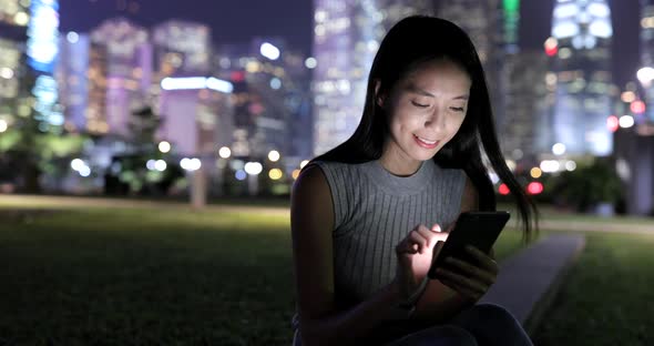 Woman using mobile phone in Hong Kong 