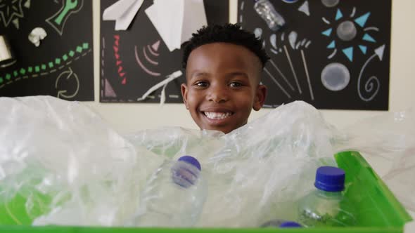 Boy holding a recycling crate