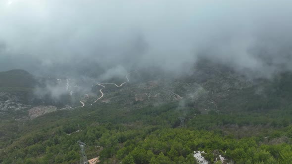 Foggy road in the mountains aerial view 4 K