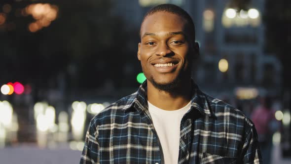 Portrait of Handsome Young African American Man Guy Boyfriend in Plaid Shirt Standing in City in