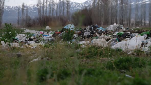 Ground Scattered Piles of Garbage