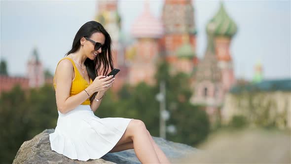 Happy Young Urban Woman in European City