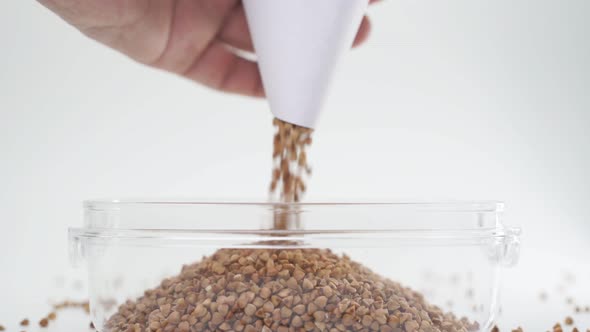 Buckwheat Is Poured Into a Jar for Storage. Buckwheat Stocks During the Period of Self-isolation