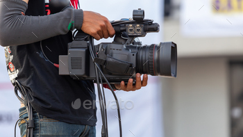 Close up Professional videographer on event, videographer filmmaker cinematographer camera.