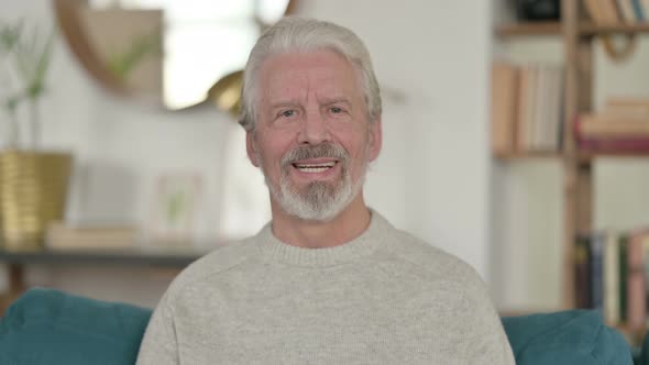 Old Man Smiling at Camera at Home 