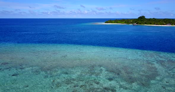 Wide angle fly over abstract view of a paradise sunny white sand beach and turquoise sea background 