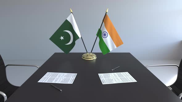 Flags of Pakistan and India on the Table alt