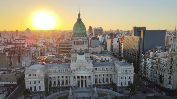 Aerial dolly in of Argentine Congress Palace with Balvanera neighborhood buildings in background at