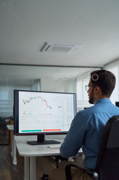 Busy business man broker investor using computer analyzing stock market.